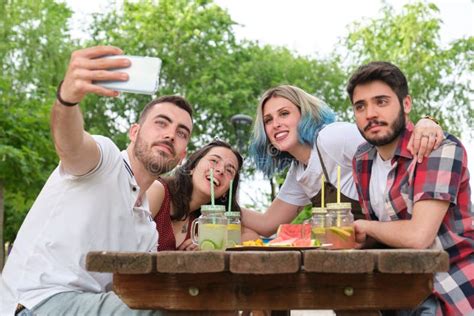 Group Of Happy Friends Taking A Selfie And Having Fun In A Park Stock Image Image Of Picnic