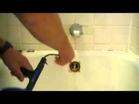 How do you unclog a bathtub drain when drano doesn't work? How To Snake Out A Bathtub Drain - YouTube