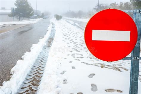 Forbidden Direction Road Sign On A Snowy Road In Winter Stock Photo