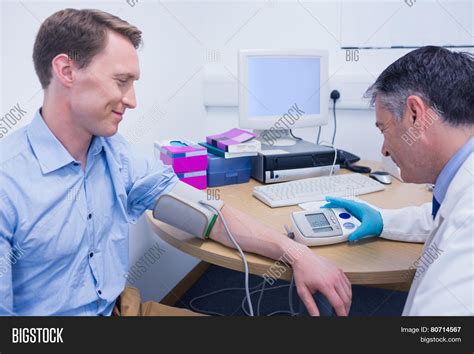 Doctor Measuring His Image Photo Free Trial Bigstock