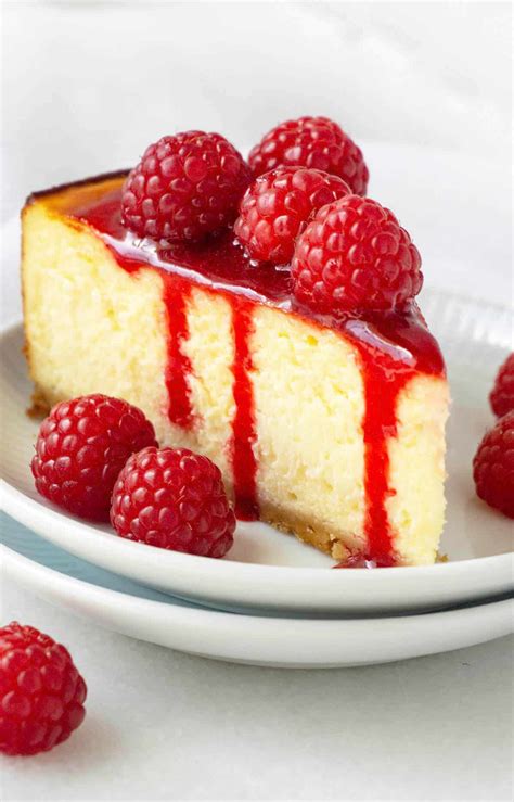 To make the cheesecake base, put the biscuits in a plastic bag and crush with a rolling pin until it resembles fine crumbs but still has texture. White Chocolate Raspberry Cheesecake | Foodtasia