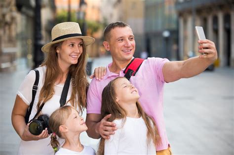 Joyful Parents With Two Kids Taking Selfie Stock Image Image Of