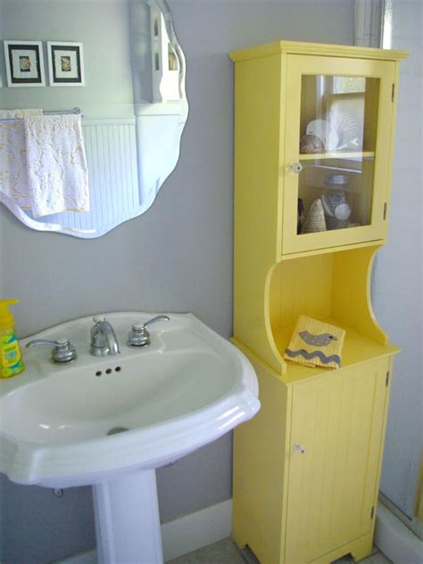 There's no doubt about it — yellow is just one of those happy, sunny colors that can instantly brighten a space. Oleander and Palm: Grey and Yellow Bathroom Redo