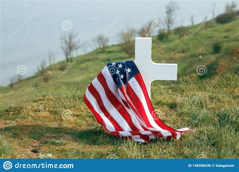 The Grave Of A Soldier American Flag Over The Grave Of The Deceased