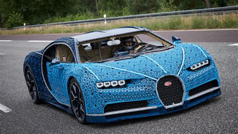 The lego technic™ bugatti chiron meets the original chiron at the french luxury brand's headquarters in molsheim, where the super sports car is built by hand.© the lego group. Lego Technic Bugatti Chiron