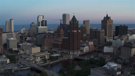 5 7k stock footage aerial video of a riverfront office tower at twilight downtown milwaukee