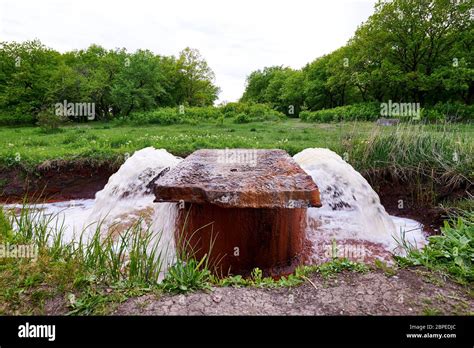 The discharge of wastewater into the river. Industrial wastewater flow