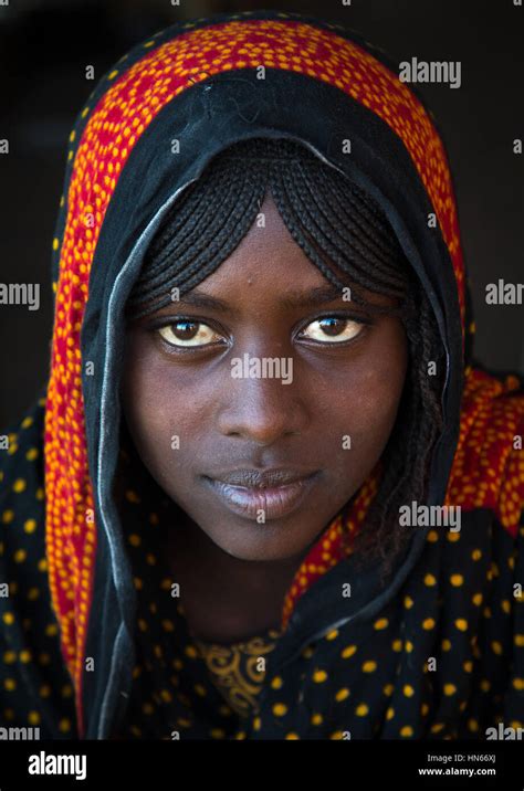 Portrait Of A Smiling Afar Tribe Teenage Girl With Braided Hair Afar