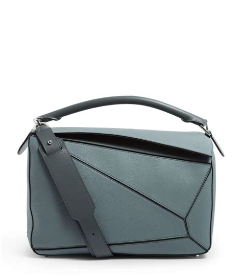What kind of bag is the loewe puzzle bag? Loewe Large Leather Puzzle Shoulder Bag in Gray for Men ...