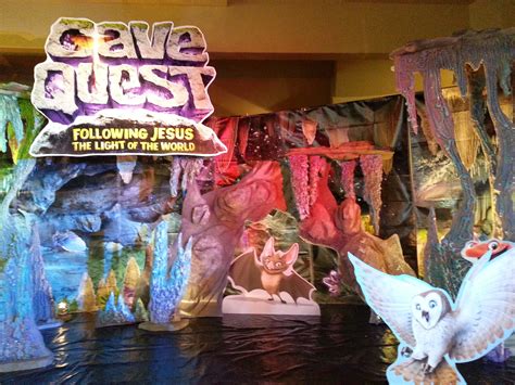 Some Fake Animals Are On Display In Front Of A Sign That Says Cave