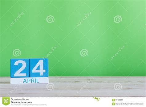 April 24th Day 24 Of Month Calendar On Wooden Table And Green
