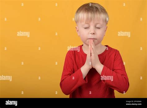 Boy Child Praying Stock Photo Alamy