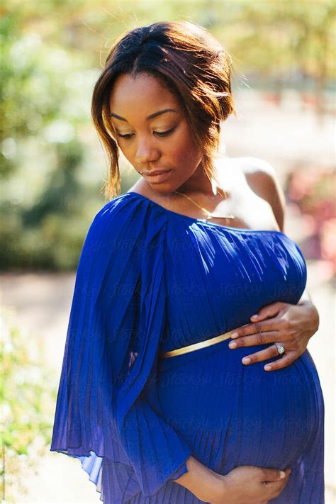 Portrait Of A Beautiful Pregnant African American Woman By Stocksy Contributor Kristen