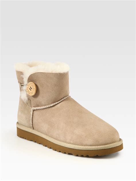 ugg mini bailey button suede shearlinglined boots in beige sand lyst