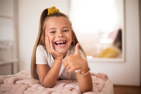 Smiling Little Girl In Bedroom Alone Stock Photo Image Of Person