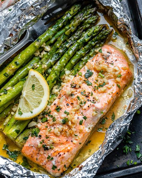 Rub the salmon with oil, salt, and pepper: Baked Salmon in Foil Packs with Asparagus and Garlic Butter Sauce - Best Salmon Recipe — Eatwell101
