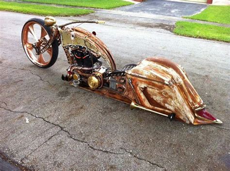 An Unusual Looking Motorcycle Is Parked On The Street
