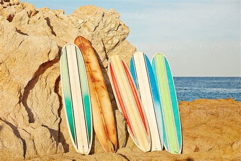 Vintage Surfboards Leaning Up Against Rocks On Beach In Mexico By My