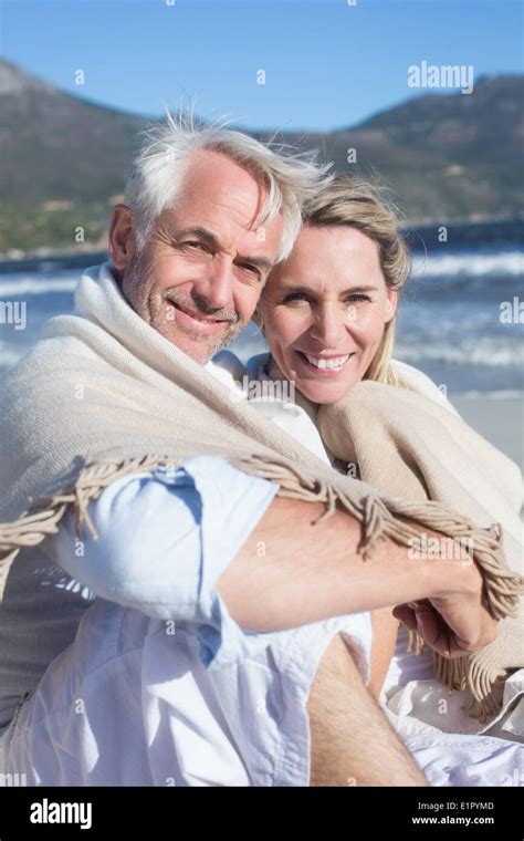 Couple Sitting On The Beach Hi Res Stock Photography And Images Alamy