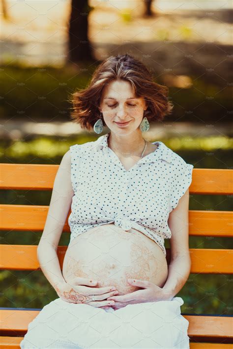 young-pregnant-woman-siting-on-a-high-quality-nature-stock-photos