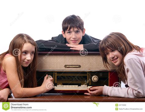 Teenage Friends Listening To Music On Old Radio Stock Photo Image Of