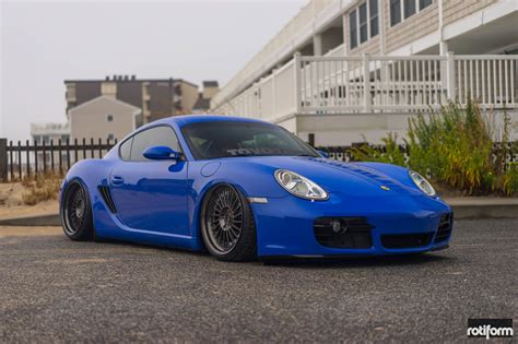 Electric Blue Porsche Cayman With Air Suspension On Black Rotiform