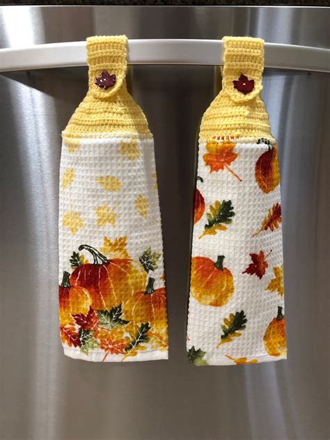 The typical kitchen towel isn't as luxurious as its bathroom counterparts, but it serves an important purpose nonetheless. Fall kitchen hand towel set with button top | Autumn ...