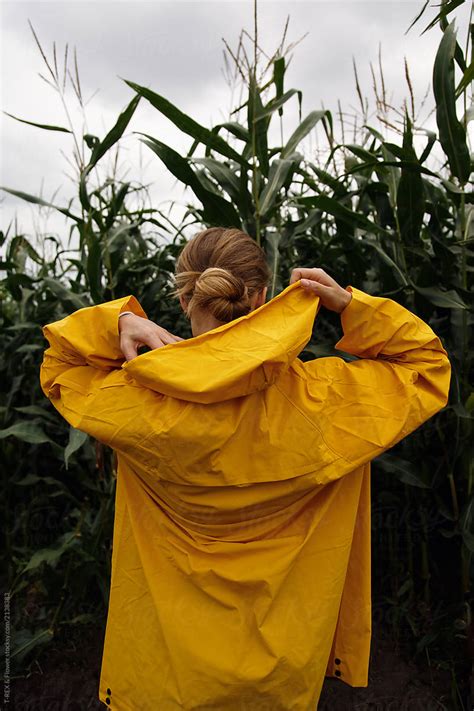 Woman Putting On Hood On Field By Stocksy Contributor Danil Nevsky