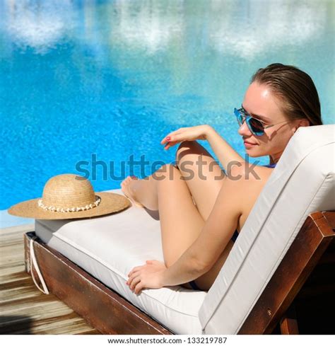 Woman Relaxing Chaise Lounge Poolside Stock Photo Edit Now