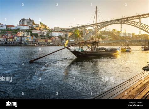 Porto Portugal Sunrise View Of Trditional Boats Rabelo With Dom Luis