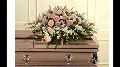 Originally, it was set over the body to protect it from what flowers do you throw on a coffin? Casket Flower Arrangements - YouTube