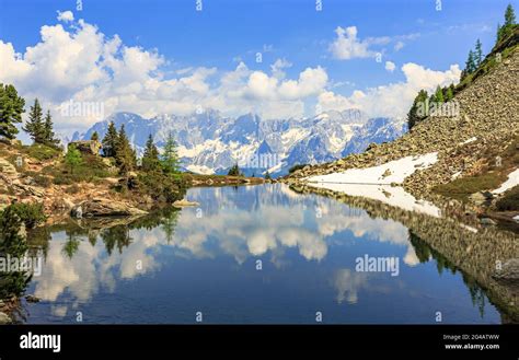 Dachstein Mountain Range Near Schladming With Reflection In The Mirror