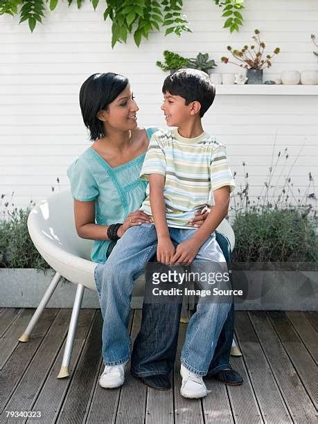 Mom Sits On Sons Lap Photos And Premium High Res Pictures Getty Images