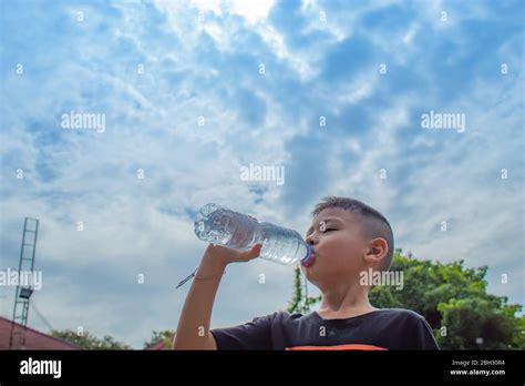 The Boys Are Drinking Cold Water Stock Photo Alamy