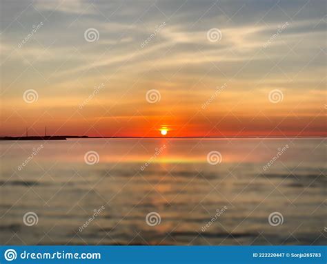 Gold Orange Sunset Dramatic Cloudy Sky Lilac Pink Sea Water Reflection