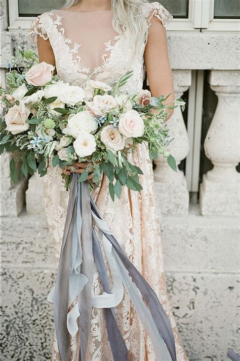 Bridal bouquet for a rustic fall wedding, made with flowers, cattails, wheat, pine cones and a deer antler. neutral wedding bouquet with grey ribbons - EmmaLovesWeddings