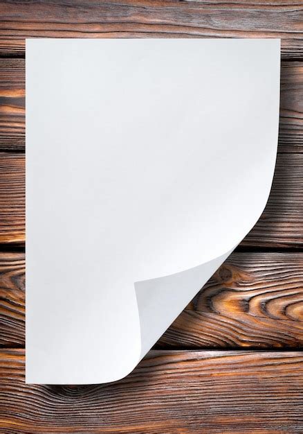 Premium Photo Sheet Of Paper On A Wooden Table