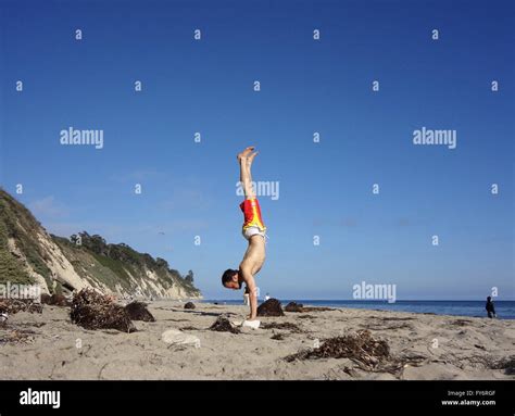Man Handstands On Beach In Santa Barbara California Stock Photo Alamy
