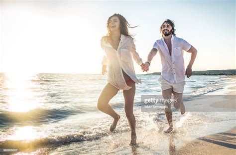 Couple On A Tropical Beach High Res Stock Photo Getty Images