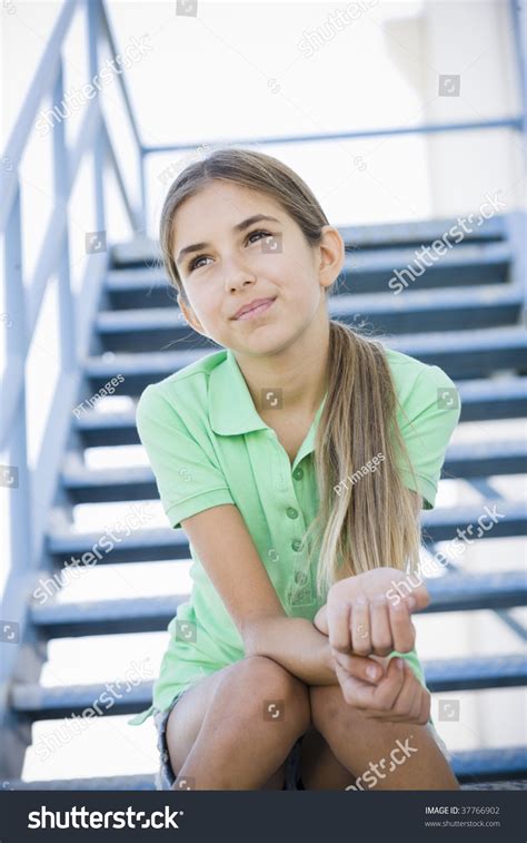 Portrait Smiling Tween Girl Sitting On Stock Photo Edit Now 37766902