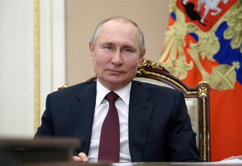 putin signs law allowing him to serve 2 more terms as russia s president cbs news