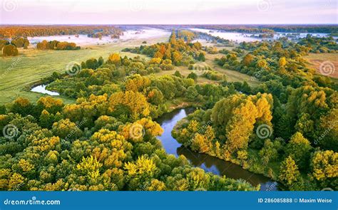 Aerial Summer Sunrise View Rural Landscape River Meandering In Forest