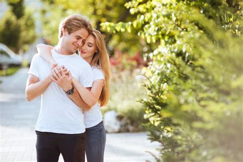 Young Couple In Love Hugging On The Street Stock Photo Image Of