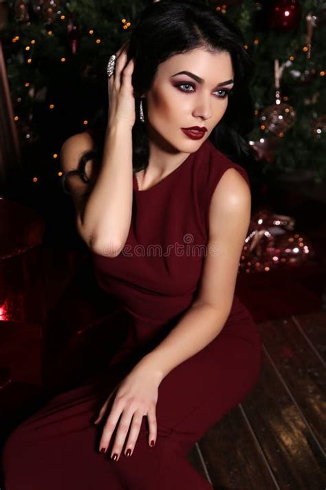 Beautiful Sensual Woman With Dark Hair Wears Elegant Dress Stock Photo