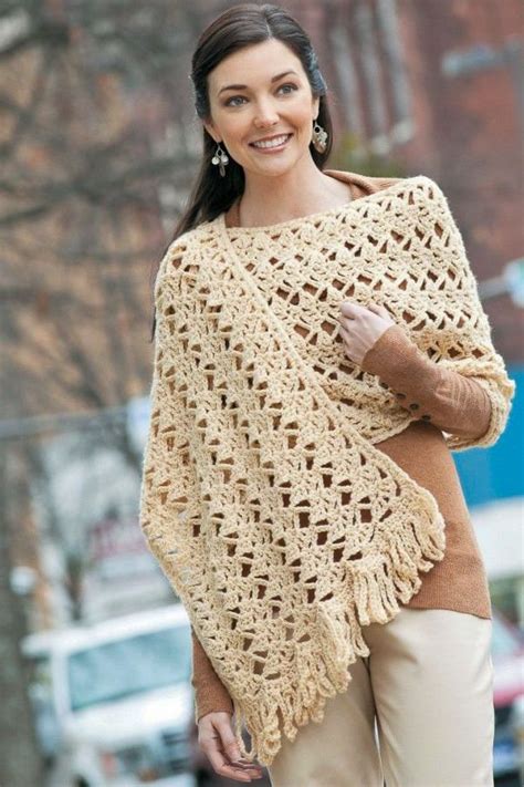 A Woman Wearing A Crocheted Shawl Standing In The Street