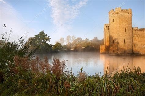 Stunning Moat And Castle In Autumn Fall Sunrise With Mist Over M ⬇