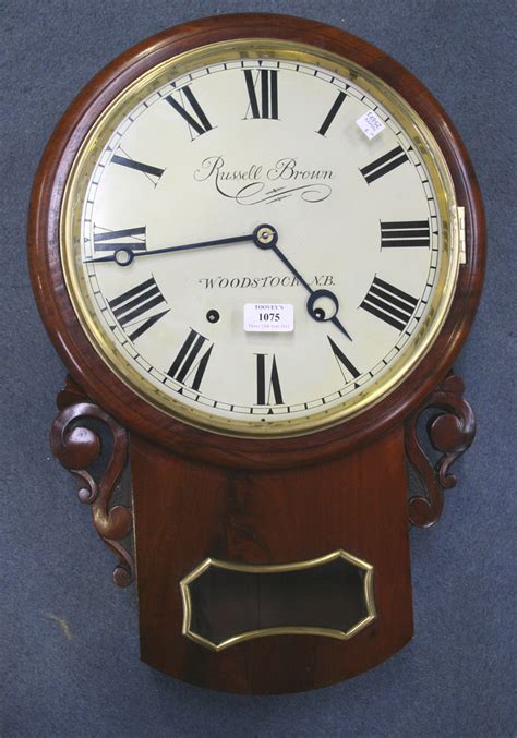 A Late 19th Century American Mahogany Drop Dial Wall Clock With Eight