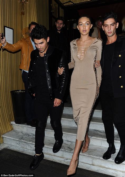 Gigi Hadid In Nude Tie Up Dress At Paris Fashion Week With Joe Jonas