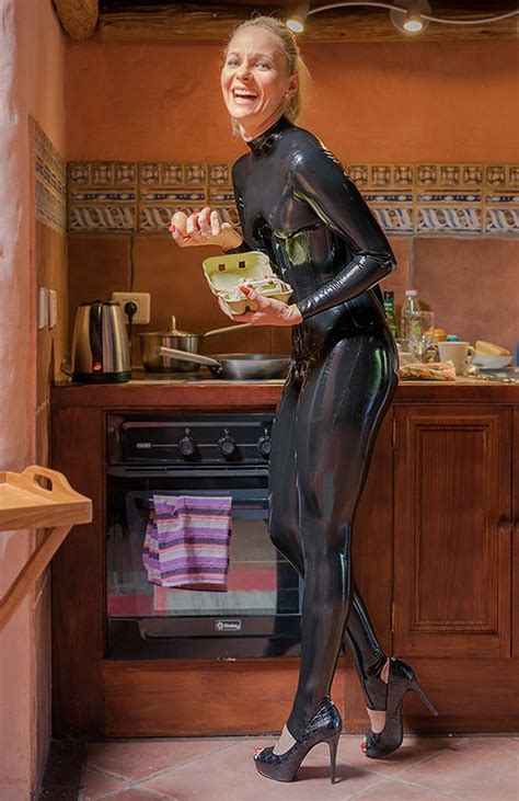 Sexy Amateur Blonde Wearing Casual Black Latex Catsuit In The Kitchen