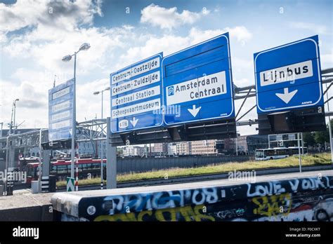 Gritty Urban Scene Of Road Signs On The Way In To Amsterdam Stock Photo